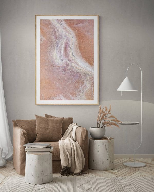 Extraordinary-experiences-comfy-warm-living-room-with-large-armchair-pink-salt-abstract-artwork-medium